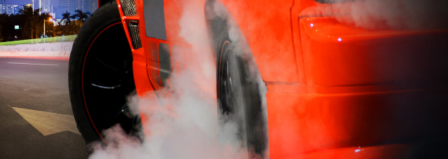 Driver stunting by doing a burnout