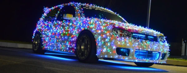 image of car decorated with Christmas lights