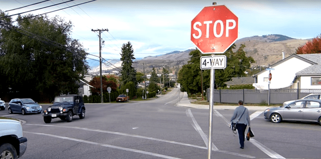 yielding to a pedestrian at a 4 way stop intersection