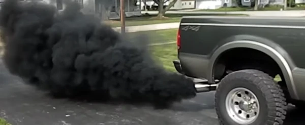 image of diesel pickup rolling coal