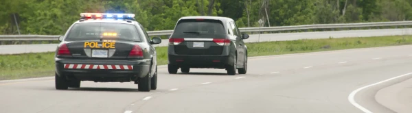 image of police vehicle pacing a speeding driver
