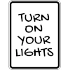 image of sign advising to turn on your lights