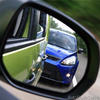 image of car in rear view showing poor following distance