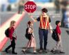 school crossing & guard helping children in crosswalk