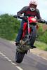 image of a motorcycle rider stunting